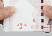 Step 3 - Alternatively, bend the note to the other side of the template with Braille. Braille marking for the $1,000 note is not necessary since the end of the note will square neatly with the edge of the template.